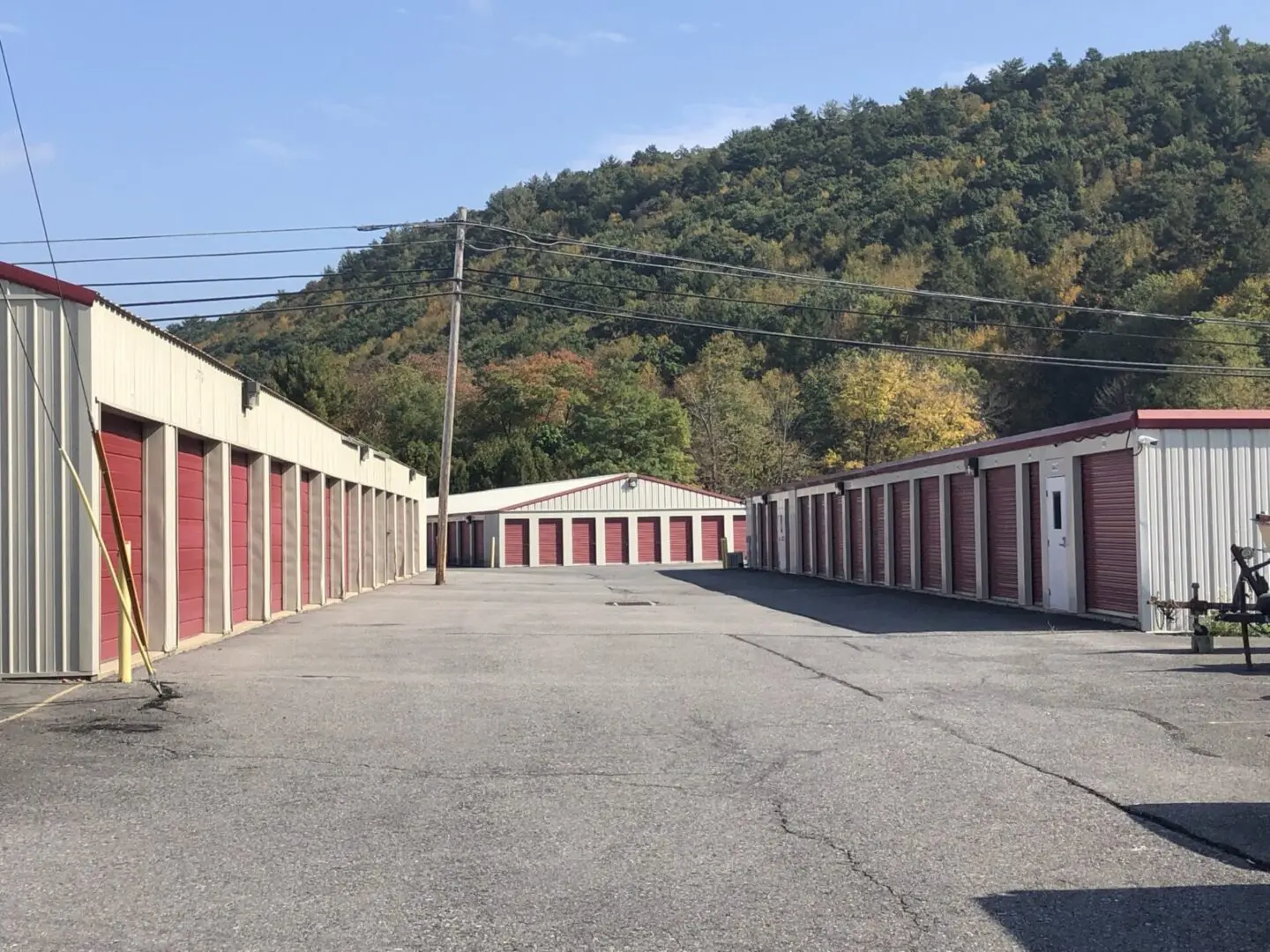 A row of storage units in an empty lot.